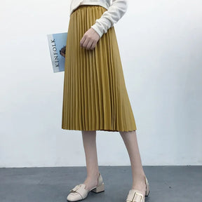 Saia Midi Plissada - Couro Ecológico você encontra na Sua Boutique por apenas  ! Com Frete Grátis para todo Brasil, podendo parcelar em até 10X Sem Juros! Alé,m disso ganhe 10% OFF no PIX! 