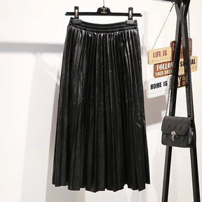 Saia Midi Plissada - Couro Ecológico você encontra na Sua Boutique por apenas  ! Com Frete Grátis para todo Brasil, podendo parcelar em até 10X Sem Juros! Alé,m disso ganhe 10% OFF no PIX! 